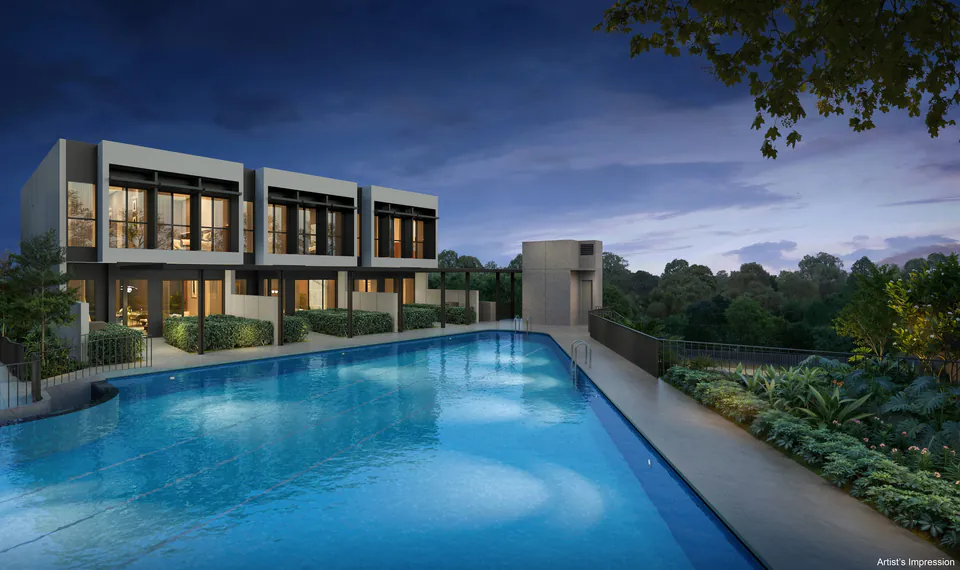 The three strata terrace houses seen across the pool at Lentor Gardens Residences.